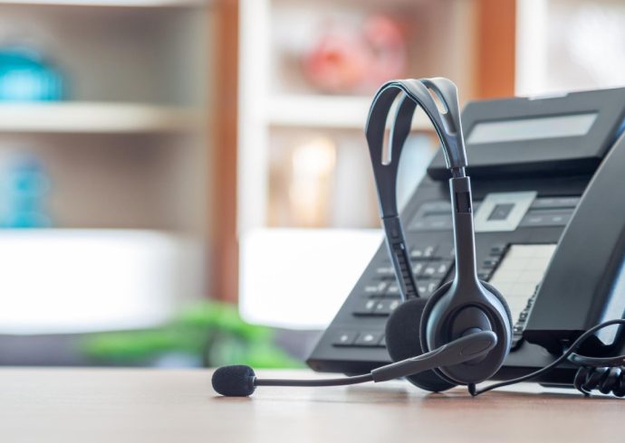 close-up-soft-focus-headset-with-telephone-devices-office-desk-customer-service-support-voip-headset-customer-service-support-call-center-concept 1